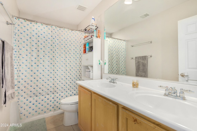 bathroom featuring tile patterned floors, vanity, and toilet