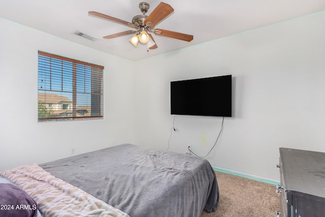 carpeted bedroom featuring ceiling fan