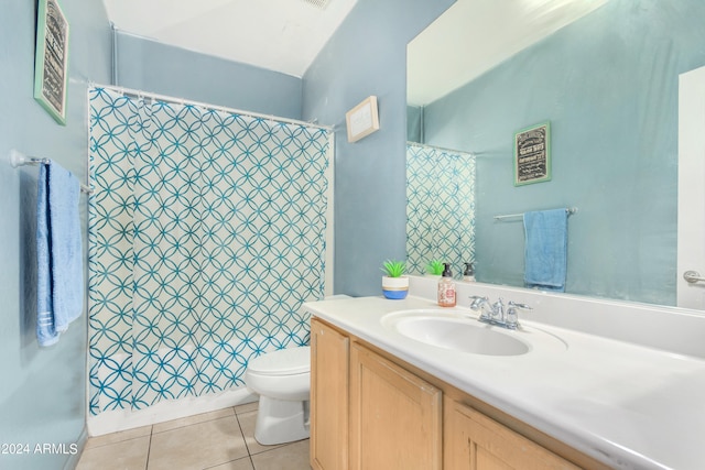 bathroom with a shower with shower curtain, tile patterned flooring, vanity, and toilet