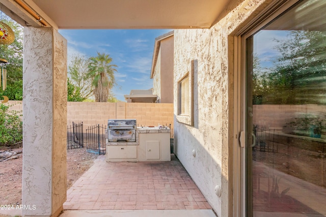 view of patio with a grill