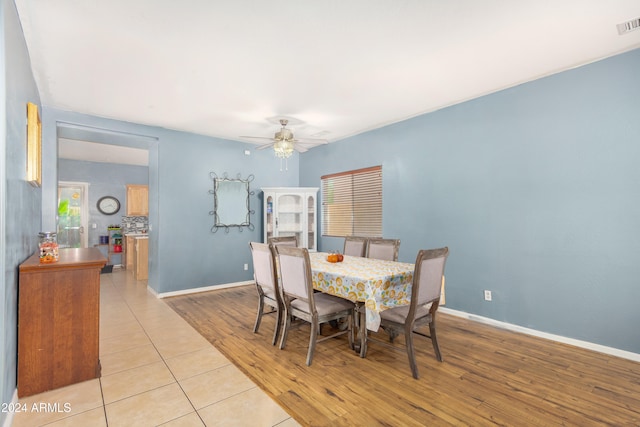 dining room featuring ceiling fan and light hardwood / wood-style flooring