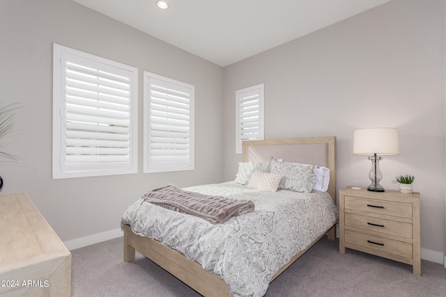 bedroom with light carpet