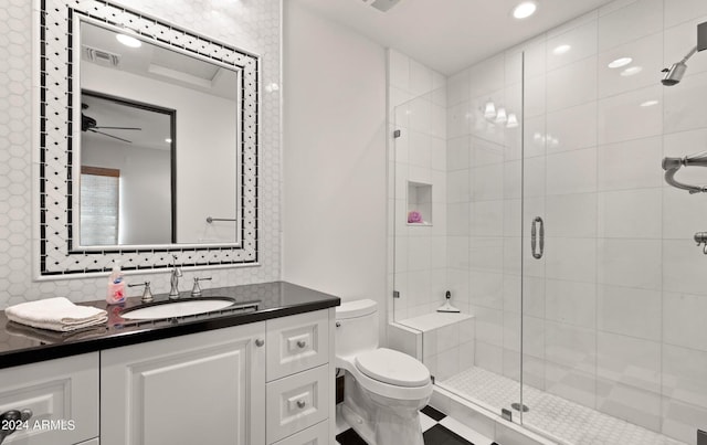 full bathroom featuring a stall shower, visible vents, vanity, and toilet