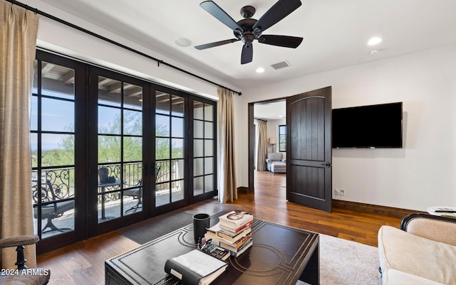 living area with french doors, recessed lighting, visible vents, wood finished floors, and baseboards