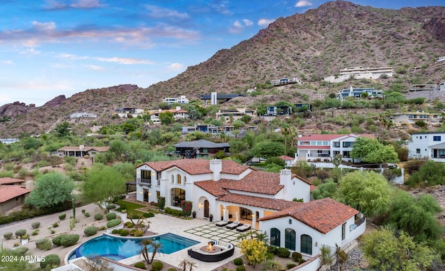 exterior space with a residential view and a mountain view