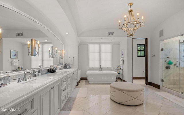 full bath with lofted ceiling, a freestanding tub, a sink, and a shower stall