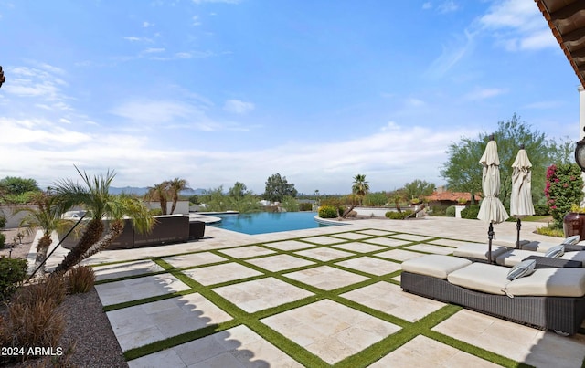 outdoor pool featuring a patio area