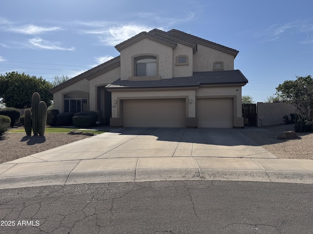 21128 N 72nd Pl, Scottsdale, AZ 85255 - view of front facade with driveway, stucco siding, an attached garage, and a tile roof