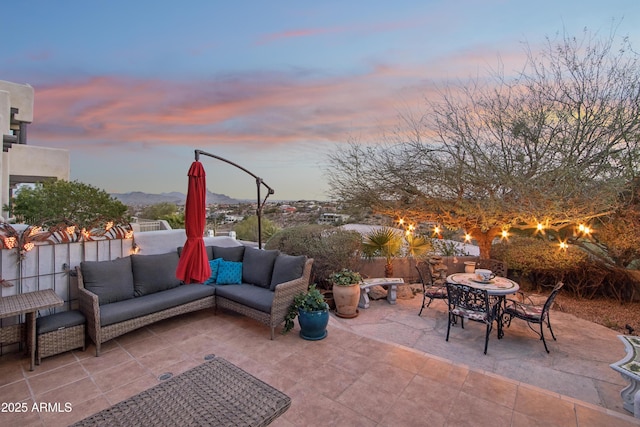 view of patio / terrace featuring outdoor dining area, fence, and an outdoor living space