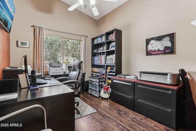 office area with a ceiling fan, lofted ceiling, and dark wood finished floors