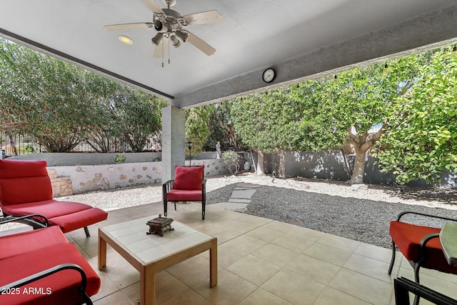 view of patio / terrace featuring ceiling fan, a fenced backyard, and an outdoor living space