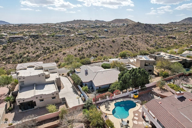 drone / aerial view featuring a residential view and a mountain view