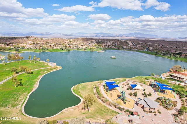 drone / aerial view with a water and mountain view