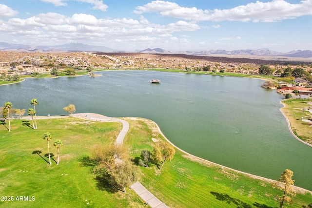 drone / aerial view with a water and mountain view