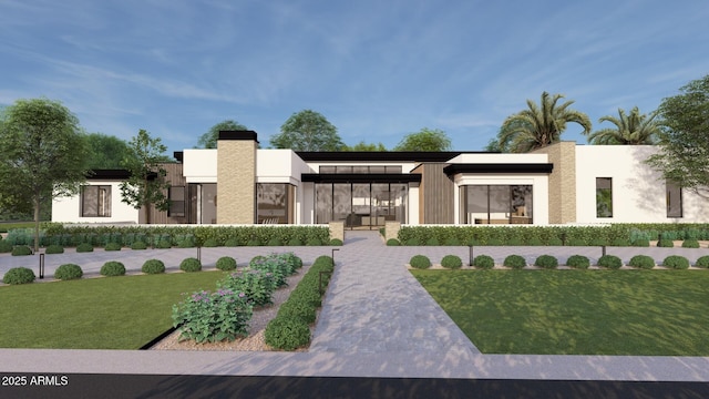 exterior space featuring stucco siding and a front lawn