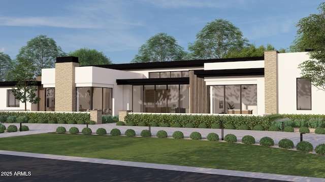 rear view of property featuring stucco siding and a yard