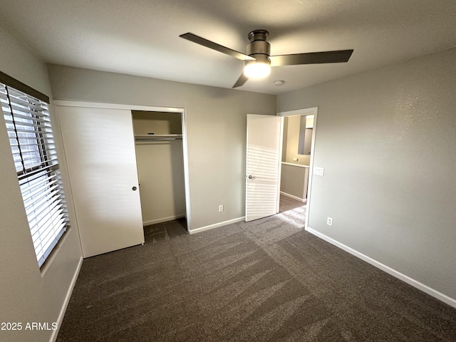 8514 S 49th Dr, Laveen, AZ 85339 - unfurnished bedroom featuring baseboards, a closet, dark colored carpet, and a ceiling fan