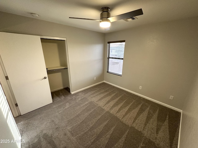 8514 S 49th Dr, Laveen, AZ 85339 - unfurnished bedroom featuring dark carpet, a closet, a ceiling fan, and baseboards