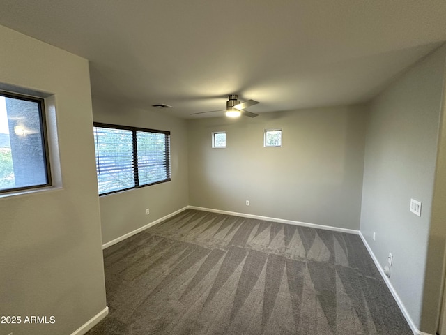 8514 S 49th Dr, Laveen, AZ 85339 - empty room with dark colored carpet, baseboards, and ceiling fan
