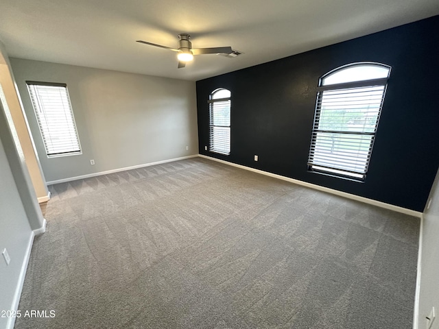 8514 S 49th Dr, Laveen, AZ 85339 - empty room featuring a ceiling fan, carpet flooring, and baseboards