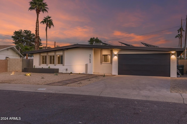 single story home with a garage