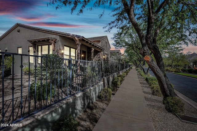 view of property exterior at dusk