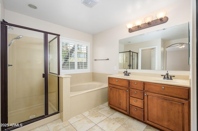 full bath with a sink, double vanity, visible vents, a garden tub, and a stall shower