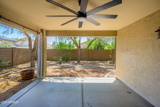 view of patio / terrace with a fenced backyard and ceiling fan