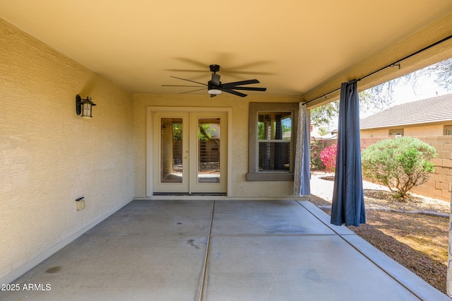 view of patio with french doors, a ceiling fan, and fence