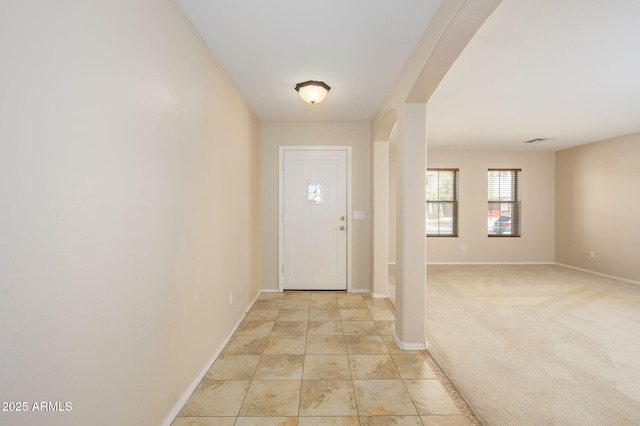 entryway featuring baseboards