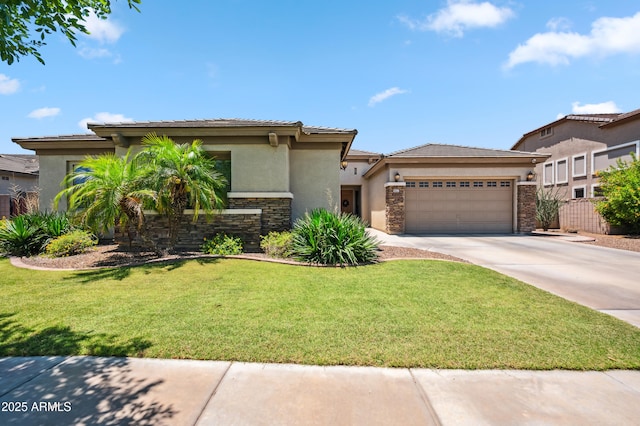 8417 W Northview Ave, Glendale, AZ 85305 - prairie-style home with stucco siding, stone siding, driveway, a garage, and a front yard