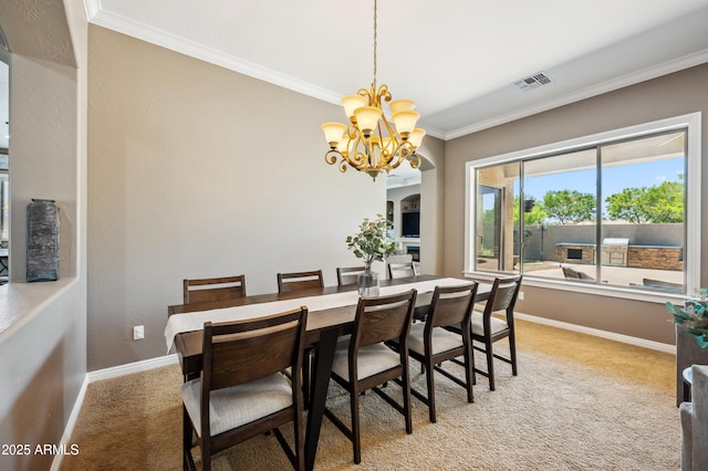8417 W Northview Ave, Glendale, AZ 85305 - dining space with ornamental molding, a chandelier, light carpet, and baseboards
