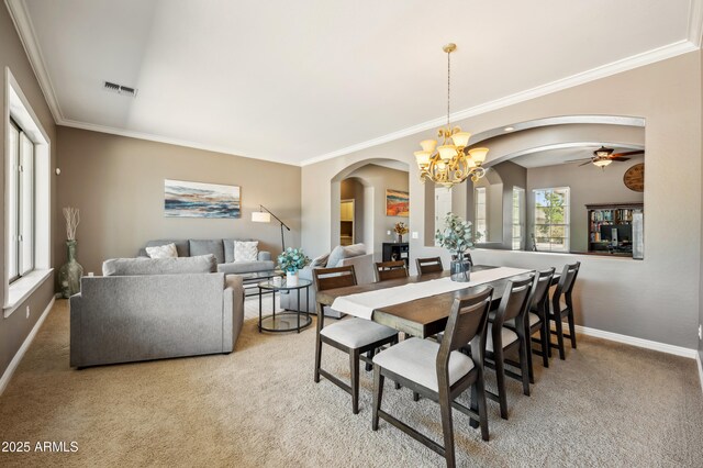 8417 W Northview Ave, Glendale, AZ 85305 - carpeted dining room with arched walkways, baseboards, crown molding, a chandelier, and a ceiling fan