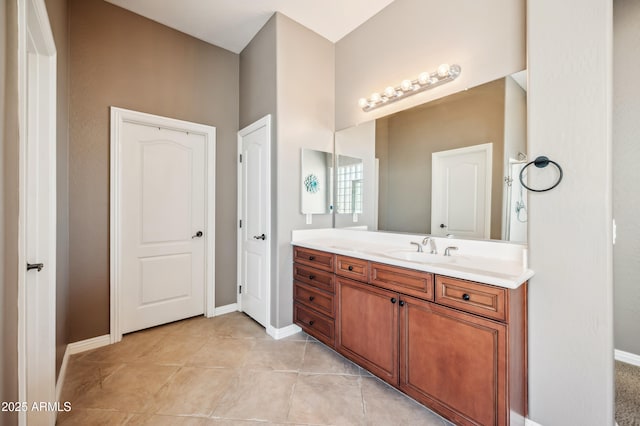 8417 W Northview Ave, Glendale, AZ 85305 - bathroom with vanity, baseboards, and tile patterned floors