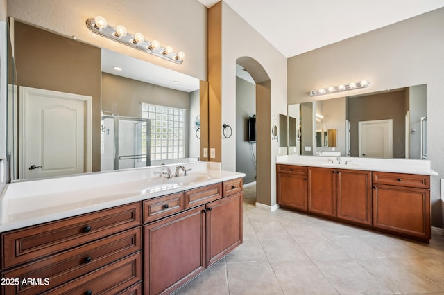 8417 W Northview Ave, Glendale, AZ 85305 - bathroom with a shower stall, two vanities, tile patterned flooring, and baseboards