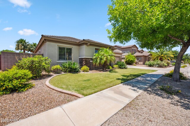 8417 W Northview Ave, Glendale, AZ 85305 - view of front of home with stucco siding, an attached garage, stone siding, concrete driveway, and a tile roof