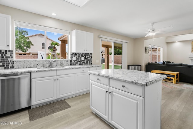 3126 W Stephens Pl, Chandler, AZ 85226 - kitchen featuring stainless steel dishwasher, a sink, ceiling fan, backsplash, and recessed lighting