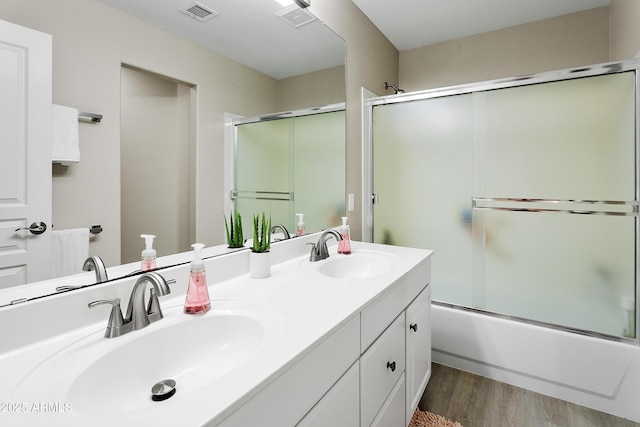 3126 W Stephens Pl, Chandler, AZ 85226 - bathroom featuring wood finished floors, double vanity, and combined bath / shower with glass door