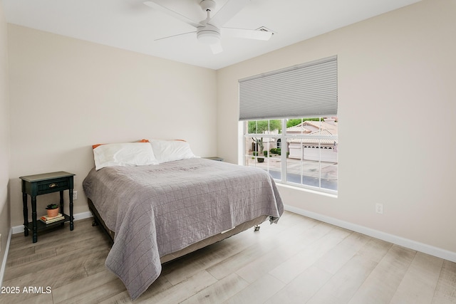 3126 W Stephens Pl, Chandler, AZ 85226 - bedroom with wood finished floors, baseboards, and a ceiling fan