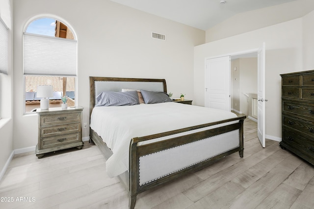 3126 W Stephens Pl, Chandler, AZ 85226 - bedroom featuring light wood-style flooring, multiple windows, vaulted ceiling, and baseboards