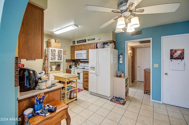 kitchen with ceiling fan, white appliances, and light tile patterned floors