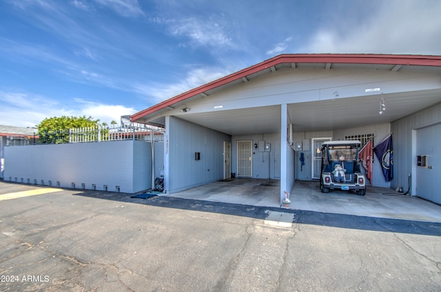 view of front of home with a carport