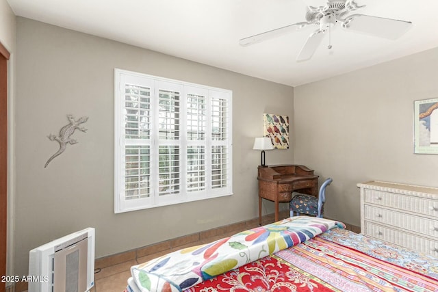 bedroom with tile patterned floors and a ceiling fan