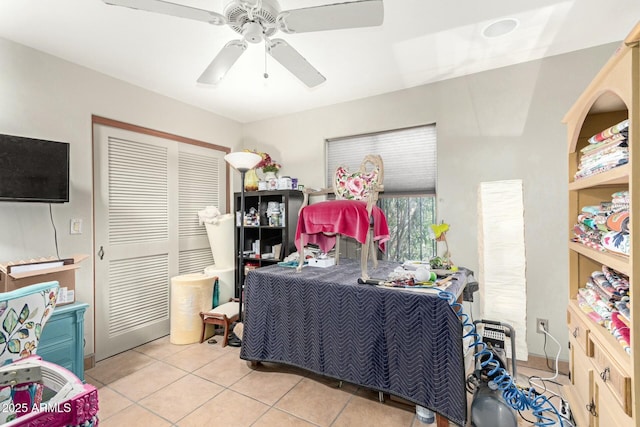 office space with tile patterned flooring and a ceiling fan