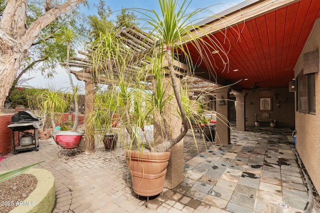 view of patio featuring a ceiling fan and grilling area