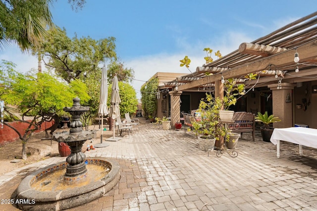 view of patio with outdoor dining space and a pergola