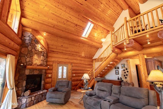 6168 W Hidden Pines Loop, Pine, AZ 85544 - living area featuring stairs, light wood finished floors, a fireplace, high vaulted ceiling, and wood ceiling