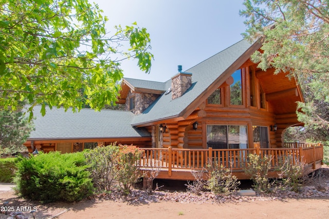 6168 W Hidden Pines Loop, Pine, AZ 85544 - rear view of property featuring log siding, a wooden deck, and a chimney