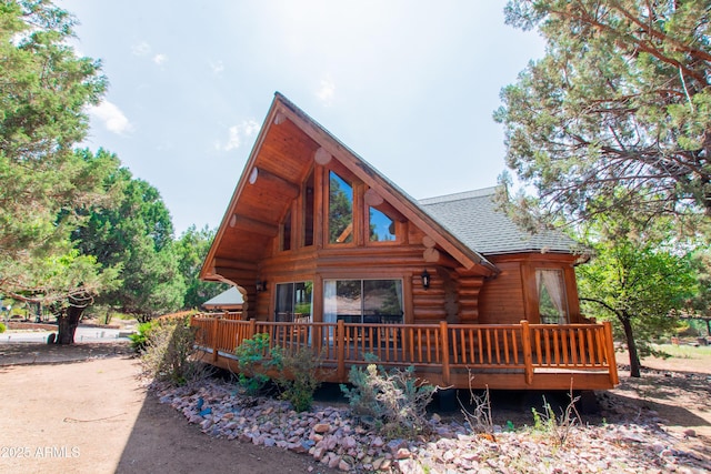 6168 W Hidden Pines Loop, Pine, AZ 85544 - view of front of property with log exterior, a wooden deck, and roof with shingles