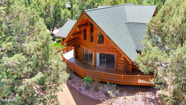 6168 W Hidden Pines Loop, Pine, AZ 85544 - view of front facade featuring log siding, a wooden deck, and a forest view